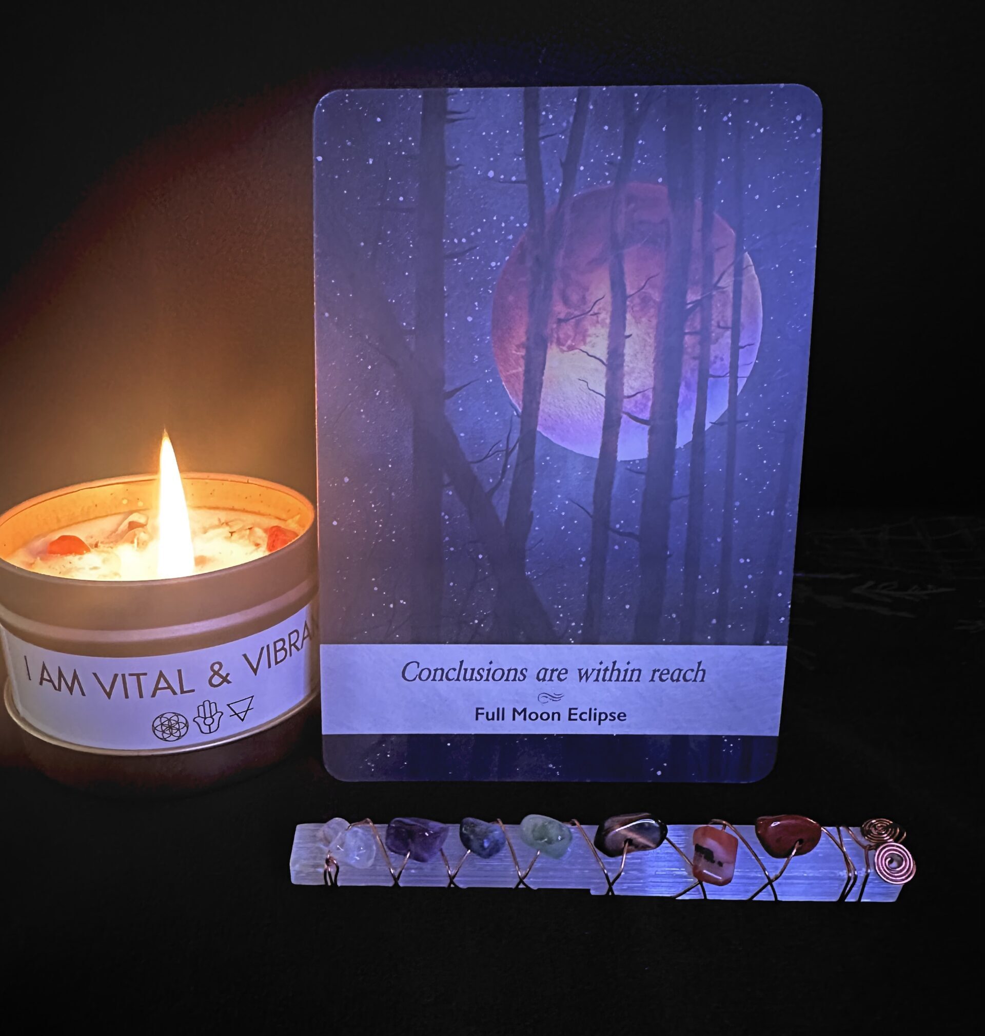 Full Moon Lunar Eclipse Oracle card with selenite wand and affirmation candle