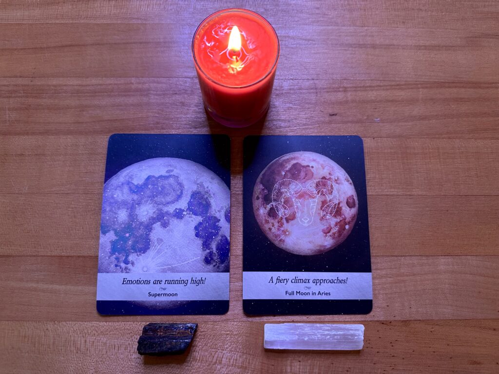 Super Moon and Full Moon oracle cards from Moonology Oracle deck by Yasmin Boland. Root chakra candle, black tourmaline and selenite ground and clear energy.